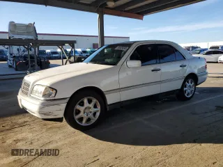 1997 Mercedes-Benz C with VIN WDBHA28E8VF557141, listed as a Copart auction lot 50569695 with 182,339 mi miles and Salvage Title. Bid and sale history available at carsss.com. Image 1.