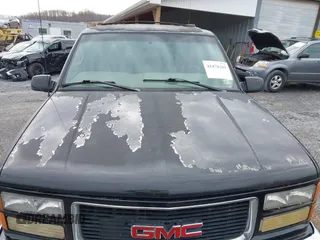 1999 GMC Yukon with VIN 1GKEK13R9XJ807786, listed as a IAAI auction lot 41478109 with 193,748 mi miles. Bid and sale history available at carsss.com. Image 12.