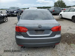 2014 Volkswagen Jetta S with VIN 3VW2K7AJ8EM231099, listed as a Copart auction lot 65752605 with 143,010 mi miles and Salvage title. Bid and sale history available at DreamBid. Image 6.