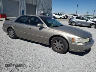 2000 Cadillac Seville Touring STS z VIN 1G6KY5498YU255607, wystawiony jako Copart lot #71130714 z przebiegiem 146 046 mil mil oraz Szkoda całkowita • Salvage title. Historia ofert i sprzedaży dostępna na DreamBid. Obrazek 4.