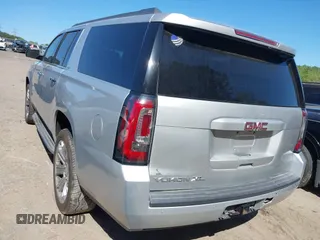 2015 GMC Yukon XL SLT with VIN 1GKS1HKC8FR221608, listed as a IAAI auction lot 42044318 with 215,757 mi miles. Bid and sale history available at carsss.com. Image 3.