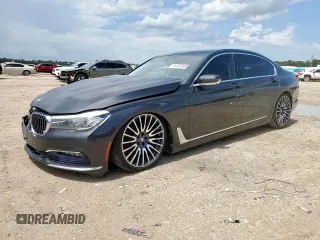2016 BMW 7 Series 740i with VIN WBA7E2C57GG714564, listed as a Copart auction lot 64005965 with 111,598 mi miles and Salvage title. Bid and sale history available at DreamBid. Image 1.