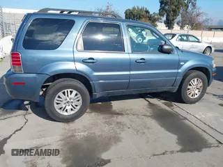 2005 Mercury Mariner Luxury z VIN 4M2CU57135DJ07230, wystawiony jako IAAI lot #41461657 z przebiegiem 267 105 mil mil oraz . Historia ofert i sprzedaży dostępna na DreamBid. Obrazek 4.