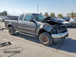 2002 Ford F-150 XL with VIN 1FTPX18L32NB65156, listed as a Copart auction lot 61418955 with 176,622 mi miles and Salvage title. Bid and sale history available at DreamBid. Image 4.
