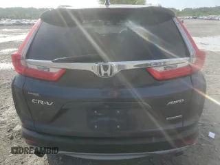 2018 Honda CR-V Touring z VIN 7FARW2H94JE077885, wystawiony jako Copart lot #55451345 z przebiegiem 133 964 mil mil oraz Szkoda całkowita • Salvage title. Historia ofert i sprzedaży dostępna na DreamBid. Obrazek 6.