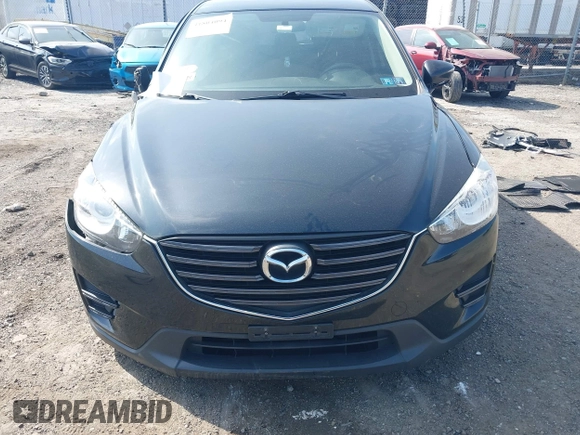 2016 Mazda CX-5 Sport with VIN JM3KE4BY3G0843177, listed as a IAAI auction lot 41804094 with 193,461 mi miles. Bid and sale history available at carsss.com. Image 12.