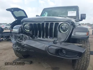 2021 Jeep Gladiator Overland with VIN 1C6HJTFG4ML617175, listed as a IAAI auction lot 42148031 with 70,627 mi miles and . Bid and sale history available at DreamBid. Image 6.