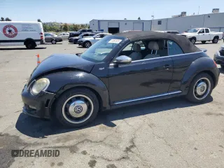 2013 Volkswagen Beetle 50s Edition with VIN 3VW5P7AT3DM802920, listed as a Copart auction lot 61097615 with 104,690 mi miles and Salvage title. Bid and sale history available at DreamBid. Image 1.