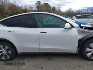 2023 Tesla Model Y Long Range z VIN 7SAYGDEE4PF621640, wystawiony jako IAAI lot #41796502 z przebiegiem 68 484 mil mil oraz . Historia ofert i sprzedaży dostępna na DreamBid. Obrazek 14.