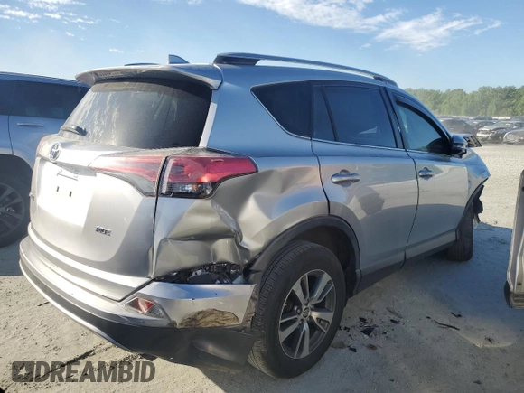 2018 Toyota RAV4 XLE with VIN JTMWFREV0JJ191707, listed as a Copart auction lot 57821575 with Not provided miles and Salvage title. Bid and sale history available at DreamBid. Image 3.