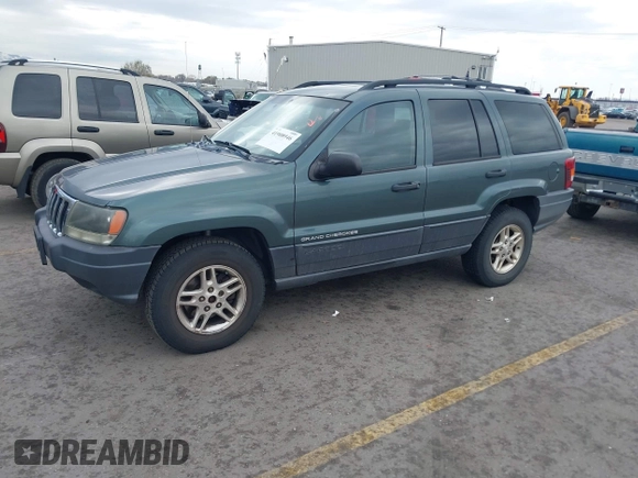 2003 Jeep Grand Cherokee Laredo with VIN 1J4GX48S03C536709, listed as a IAAI auction lot 41908946 with 240,435 mi miles. Bid and sale history available at carsss.com. Image 2.