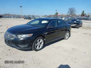 2013 Ford Taurus SEL with VIN 1FAHP2E96DG148836, listed as a IAAI auction lot 42030387 with 192,218 mi miles and . Bid and sale history available at carsss.com. Image 2.