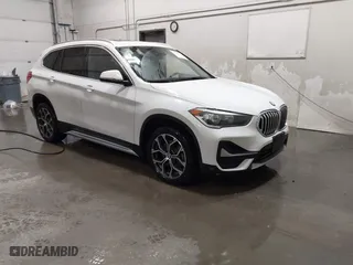 2021 BMW X1 xDrive28i with VIN WBXJG9C03M5T23289, listed as a IAAI auction lot 41603974 with 60,798 mi miles. Bid and sale history available at carsss.com. Image 1.