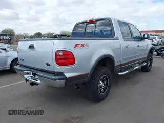 2003 Ford F-150 XLT with VIN 1FTRW08LX3KC79700, listed as a IAAI auction lot 41680562 with 131,052 mi miles. Bid and sale history available at carsss.com. Image 4.
