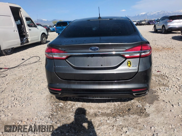 2017 Ford Fusion SE z VIN 3FA6P0H98HR350163, wystawiony jako Copart lot #54196545 z przebiegiem Nie podano mil oraz Szkoda całkowita • Salvage title. Historia ofert i sprzedaży dostępna na DreamBid. Obrazek 6.