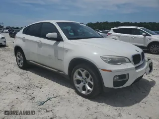 2014 BMW X6 xDrive35i with VIN 5UXFG2C53E0C44534, listed as a Copart auction lot 56518074 with 141,924 mi miles and Salvage Title. Bid and sale history available at carsss.com. Image 4.