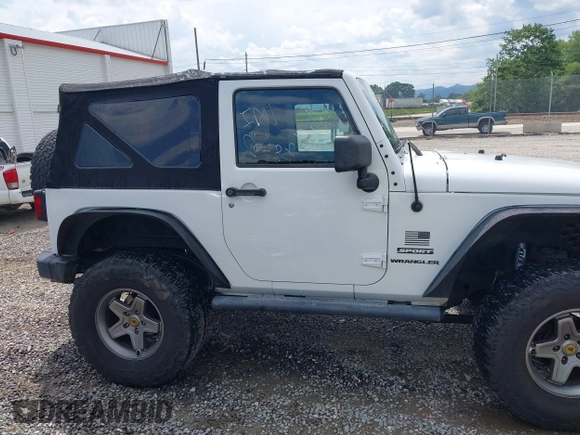 2012 Jeep Wrangler Sport z VIN 1C4AJWAG5CL171961, wystawiony jako IAAI lot #42590232 z przebiegiem 126 372 mil mil oraz . Historia ofert i sprzedaży dostępna na DreamBid. Obrazek 13.