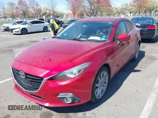 2014 Mazda 3 S Grand Touring with VIN JM1BM1W32E1107542, listed as a IAAI auction lot 42070484 with 132,395 mi miles and . Bid and sale history available at DreamBid. Image 2.