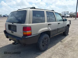 1995 Jeep Grand Cherokee Laredo with VIN 1J4GZ58Y5SC541987, listed as a IAAI auction lot 42430890 with 246,824 mi miles and . Bid and sale history available at DreamBid. Image 4.