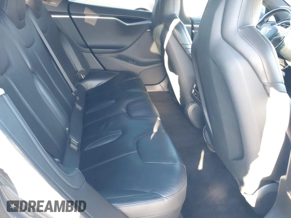 2015 Tesla Model S 85D with VIN 5YJSA1E28FF110066, listed as a IAAI auction lot 40672973 with 100,157 mi miles. Bid and sale history available at carsss.com. Image 8.