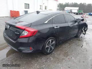2017 Honda Civic Sedan Touring with VIN 2HGFC1F99HH658034, listed as a IAAI auction lot 41563627 with 140,819 mi miles. Bid and sale history available at carsss.com. Image 4.