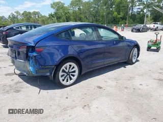 2023 Tesla Model 3 with VIN 5YJ3E1EA0PF658080, listed as a IAAI auction lot 42008846 with 32,301 mi miles and . Bid and sale history available at carsss.com. Image 4.