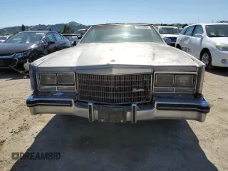 1985 Cadillac Eldorado z VIN 1G6EL578XFE661216, wystawiony jako Copart lot #54606984 z przebiegiem 12 462 mil mil oraz Szkody całkowita. Historia ofert i sprzedaży dostępna na DreamBid. Obrazek 5.