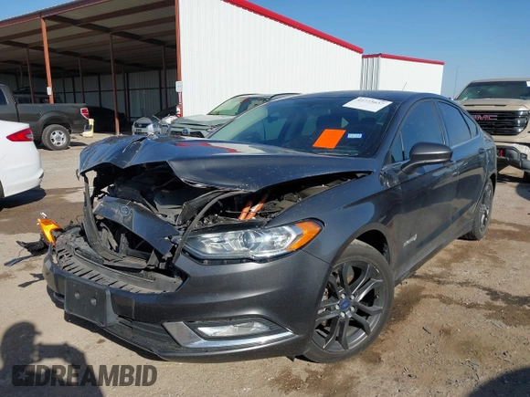 2018 Ford Fusion SE z VIN 3FA6P0LU8JR116073, wystawiony jako IAAI lot #41773037 z przebiegiem 100 864 mil mil oraz . Historia ofert i sprzedaży dostępna na DreamBid. Obrazek 2.