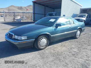 1993 Cadillac Eldorado ESC z VIN 1G6EL12Y4PU609197, wystawiony jako IAAI lot #41902066 z przebiegiem 96 251 mil mil oraz . Historia ofert i sprzedaży dostępna na DreamBid. Obrazek 2.