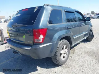 2007 Jeep Grand Cherokee Laredo with VIN 1J8HR48PX7C660601, listed as a IAAI auction lot 41652509 with 131,556 mi miles. Bid and sale history available at carsss.com. Image 4.