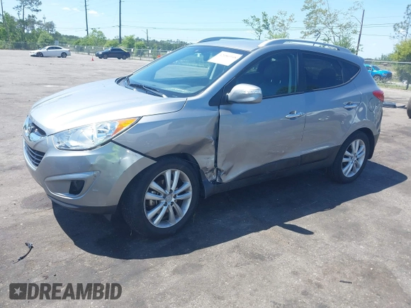 2013 Hyundai Tucson GLS with VIN KM8JU3AC4DU588062, listed as a IAAI auction lot 42080348 with 76,937 mi miles. Bid and sale history available at carsss.com. Image 2.