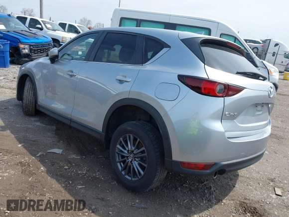 2020 Mazda CX-5 Touring with VIN JM3KFACM9L0785464, listed as a IAAI auction lot 42023311 with 90,062 mi miles and . Bid and sale history available at DreamBid. Image 3.