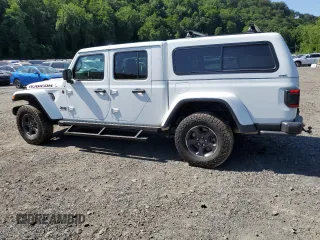 2023 Jeep Gladiator Rubicon with VIN 1C6JJTBG9PL546437, listed as a Copart auction lot 62536575 with 14,106 mi miles and Salvage title. Bid and sale history available at DreamBid. Image 2.