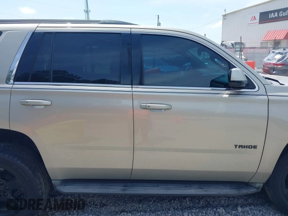 2015 Chevrolet Tahoe LT z VIN 1GNSCBKC7FR140125, wystawiony jako IAAI lot #42279760 z przebiegiem 201 335 mil mil oraz . Historia ofert i sprzedaży dostępna na DreamBid. Obrazek 13.