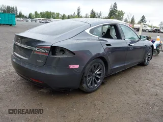 2017 Tesla Model S 100D with VIN 5YJSA1E26HF224568, listed as a IAAI auction lot 42140201 with 102,403 mi miles. Bid and sale history available at carsss.com. Image 4.