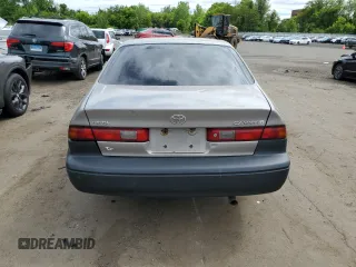 1999 Toyota Camry LE с VIN 4T1BG22K6XU404532, выставлен на аукционе Copart как лот 57449655 с пробегом 173 587 миль миль и Списание • Salvage title. История ставок и продаж доступна на DreamBid. Изображение 6.