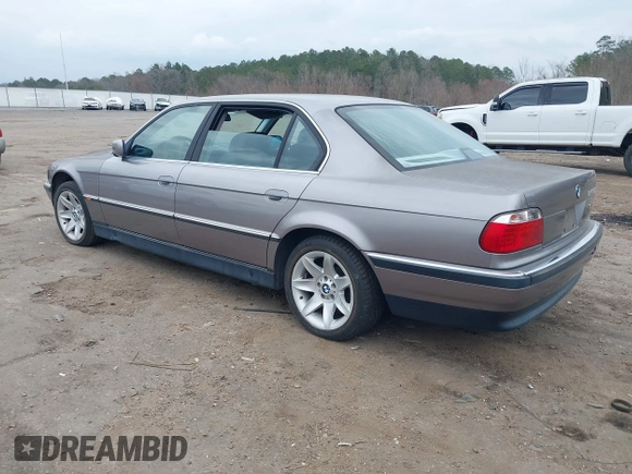 1998 BMW 7 Series 740il with VIN WBAGJ8323WDM23239, listed as a IAAI auction lot 41512630 with 221,673 mi miles. Bid and sale history available at carsss.com. Image 3.