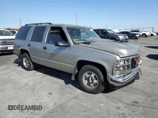 1999 GMC Yukon with VIN 1GKEC13R9XJ704929, listed as a Copart auction lot 89097295 with 87,478 mi miles and Salvage Title. Bid and sale history available at carsss.com. Image 4.