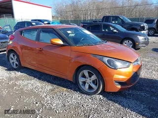 2015 Hyundai Veloster with VIN KMHTC6AD2FU225073, listed as a IAAI auction lot 41571336 with 128,819 mi miles. Bid and sale history available at carsss.com. Image 1.