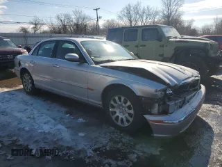 2004 Jaguar XJ with VIN SAJEA71C04SG04022, listed as a Copart auction lot 45875105 with 153,453 mi miles and Salvage Title. Bid and sale history available at carsss.com. Image 4.