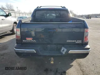 2012 Honda Ridgeline RTL z VIN 5FPYK1F51CB455815, wystawiony jako Copart lot #50969885 z przebiegiem Nie podano mil oraz Szkoda całkowita • Salvage title. Historia ofert i sprzedaży dostępna na DreamBid. Obrazek 6.