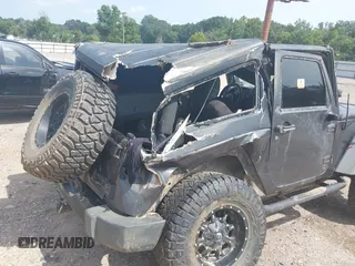 2014 Jeep Wrangler Sport with VIN 1C4AJWAGXEL233647, listed as a IAAI auction lot 39993785 with Not Provided miles and . Bid and sale history available at DreamBid. Image 6.