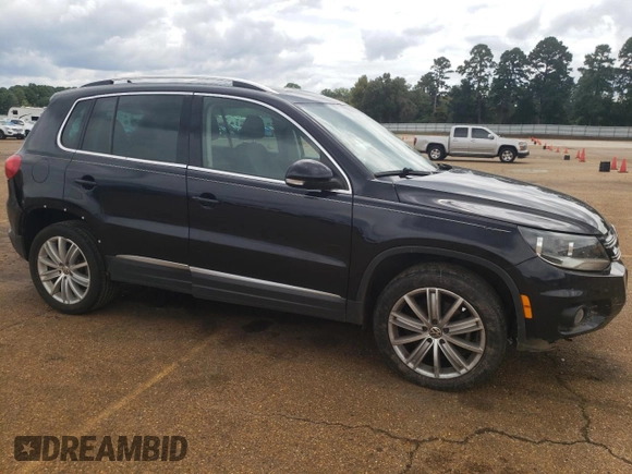 2014 Volkswagen Tiguan SEL with VIN WVGAV3AX5EW558929, listed as a Copart auction lot 71004684 with 125,628 mi miles and Clean title. Bid and sale history available at DreamBid. Image 4.