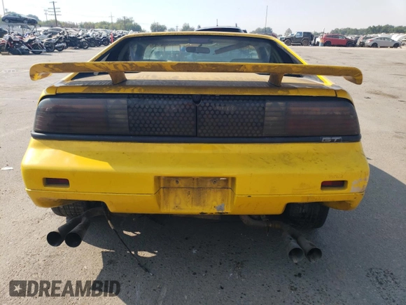 1986 Pontiac Fiero z VIN 1G2PG9796GP256622, wystawiony jako Copart lot #69203894 z przebiegiem 38 964 mil mil oraz Szkody całkowita. Historia ofert i sprzedaży dostępna na DreamBid. Obrazek 6.