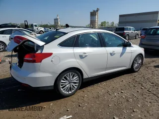 2018 Ford Focus Titanium with VIN 1FADP3J21JL294061, listed as a Copart auction lot 53827375 with 194,577 mi miles and Salvage title. Bid and sale history available at DreamBid. Image 3.