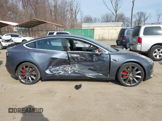 2018 Tesla Model 3 Long Range Battery with VIN 5YJ3E1EB5JF063077, listed as a IAAI auction lot 41773551 with 99,477 mi miles and . Bid and sale history available at DreamBid. Image 13.