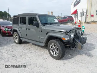 2019 Jeep Wrangler Unlimited Sahara with VIN 1C4HJXEN8KW624805, listed as a IAAI auction lot 41678249 with 104,244 mi miles and . Bid and sale history available at DreamBid. Image 1.