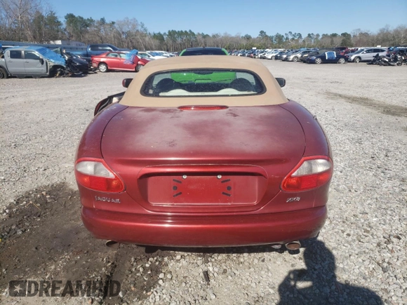 1999 Jaguar XK z VIN SAJGX2043XC032962, wystawiony jako Copart lot #49312155 z przebiegiem 74 662 mil mil oraz Szkoda całkowita • Salvage title. Historia ofert i sprzedaży dostępna na DreamBid. Obrazek 6.