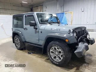 2014 Jeep Wrangler Sport with VIN 1C4AJWAG9EL322982, listed as a Copart auction lot 51145075 with 122,686 mi miles and Salvage Title. Bid and sale history available at DreamBid. Image 4.