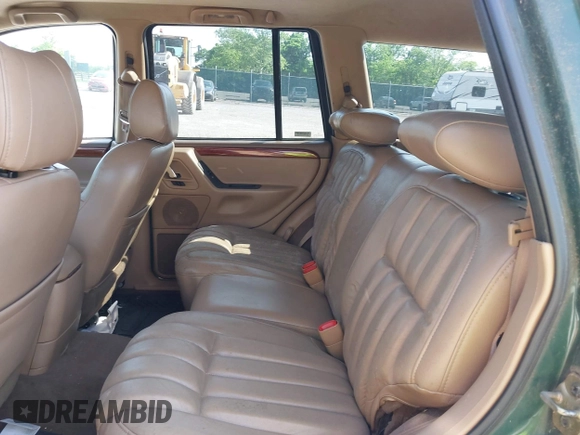 1999 Jeep Grand Cherokee Limited z VIN 1J4GW68N5XC630910, wystawiony jako IAAI lot #42380978 z przebiegiem 188 300 mil mil oraz . Historia ofert i sprzedaży dostępna na DreamBid. Obrazek 8.